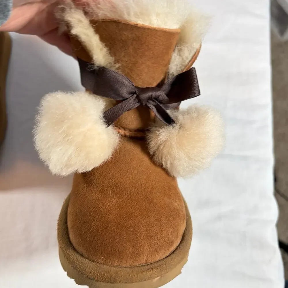 UGG Toddler Gita chestnut boots.  Front bow pom-poms.  Size 8T. Worn once